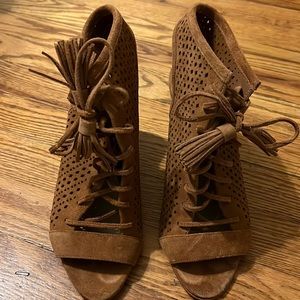 Ladies Marc Fisher suede lace up perforated wedges.